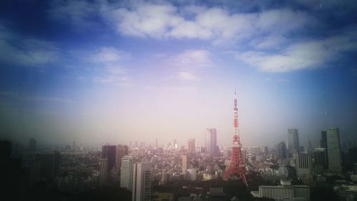 City skyline against cloudy sky