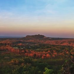 Scenic view of landscape against cloudy sky