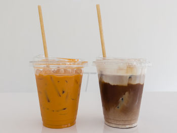 Close-up of coffee on table against white background