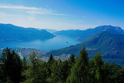 Scenic view of mountains against blue sky