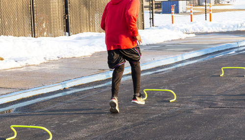 Low section of man playing on snow