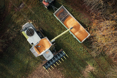 Aerial view of a combine harvesting corn with a modern machine, effective harvest