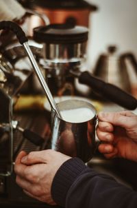 Close-up of man working with coffee