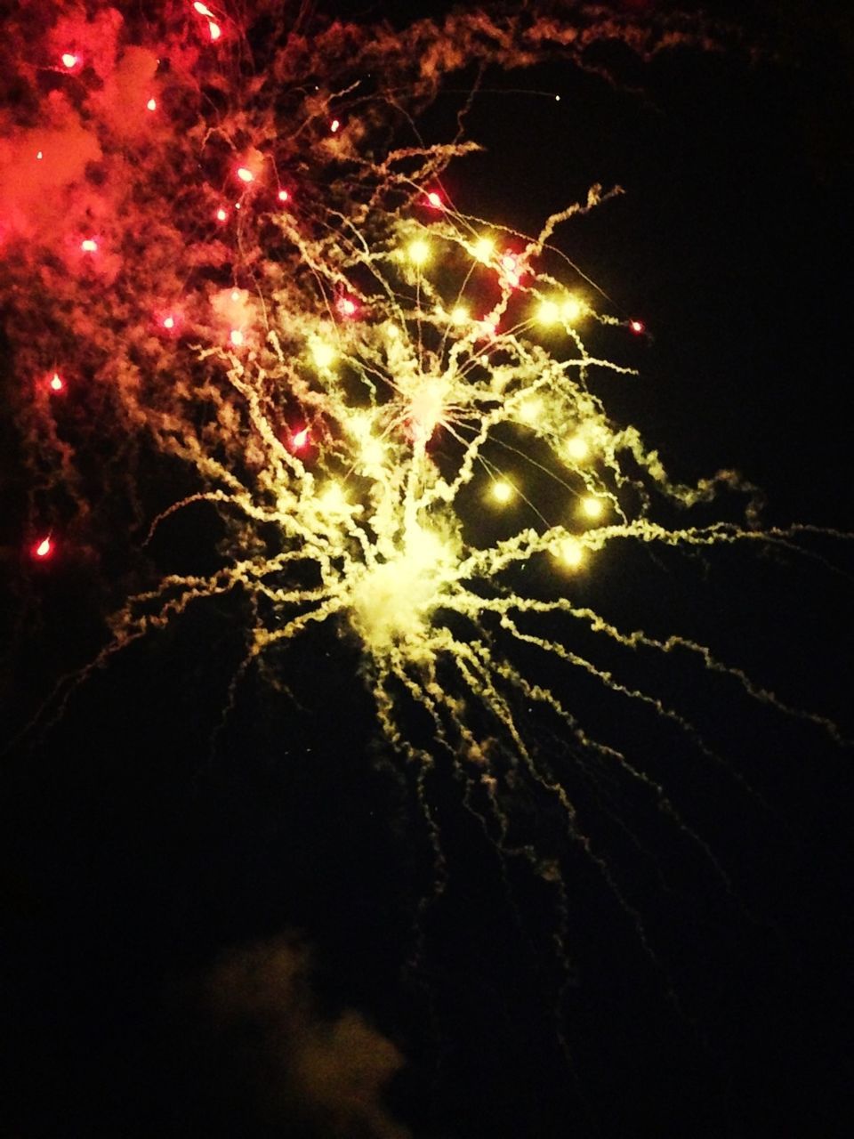 illuminated, night, celebration, glowing, firework display, exploding, low angle view, firework - man made object, arts culture and entertainment, lighting equipment, motion, celebration event, event, long exposure, multi colored, decoration, light - natural phenomenon, sparks, blurred motion, firework