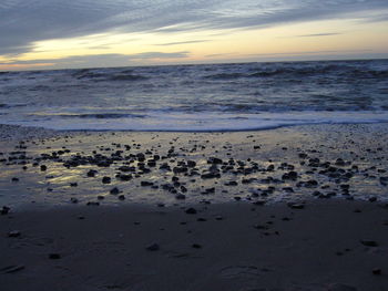 Scenic view of sea against sky at sunset
