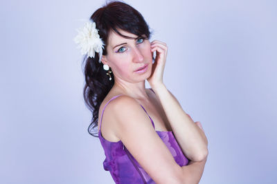 Portrait of a beautiful young woman over white background