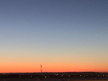 Scenic view of silhouette landscape against clear sky during sunset