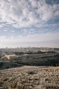 High angle view of townscape against cloudy sky