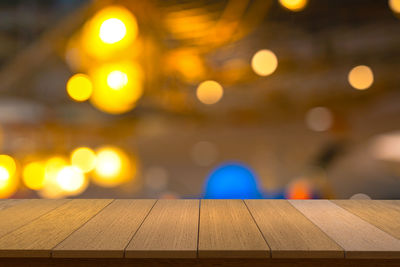 Close-up of illuminated lights on table