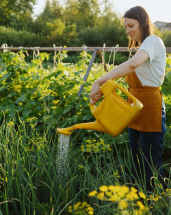 Side view of man working on field