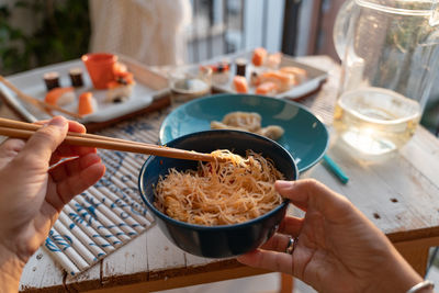 Cropped hand of person preparing food