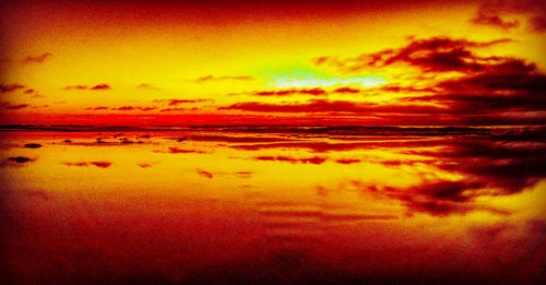 Scenic view of dramatic sky during sunset