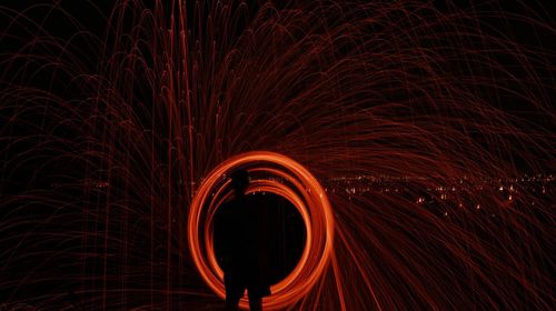 Light painting against sky at night