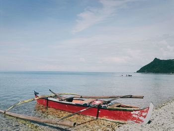 Boat in sea against sky