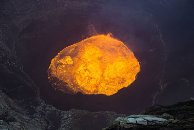 Close-up of yellow rock against sky