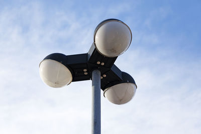 Low angle view of street light against sky