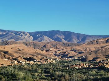 Scenic view of mountains against clear blue sky