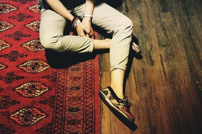 Beautiful woman standing on tiled floor