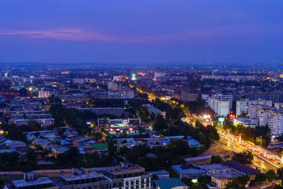 High angle view of illuminated cityscape against sky