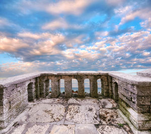 Old ruin building against cloudy sky