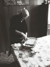 Midsection of man preparing food at home