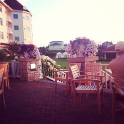 Chairs and tables against clear sky