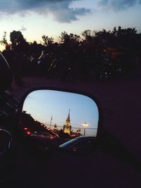 Cars parked on street at dusk