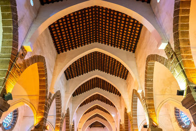 Low angle view of illuminated ceiling of building