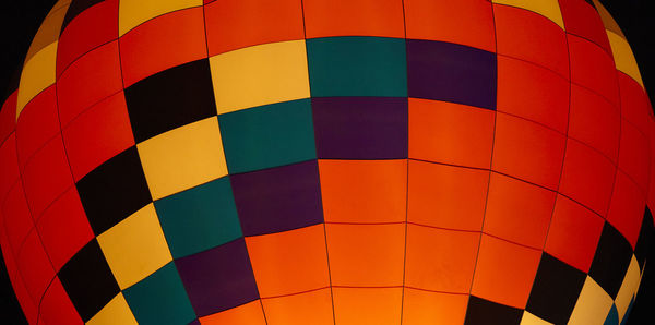 Low angle view of colorful illuminated hot air balloon at night