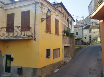 Residential buildings in city against clear sky