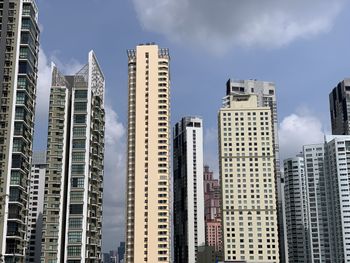 Low angle view of buildings against sky in city