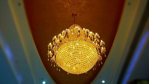 Low angle view of chandelier hanging on ceiling