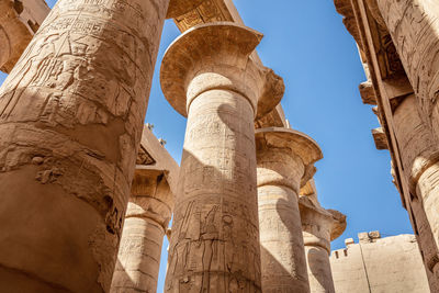 Different hieroglyphs on the walls and columns in the karnak temple.