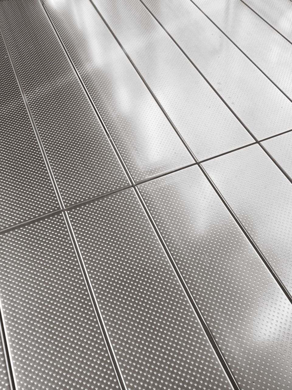 full frame, pattern, indoors, backgrounds, high angle view, design, metal, ceiling, textured, modern, repetition, close-up, no people, metallic, geometric shape, abstract, day, low angle view, detail, tile