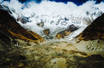 Scenic view of snow covered mountains