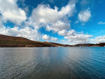 Scenic view of lake against blue sky