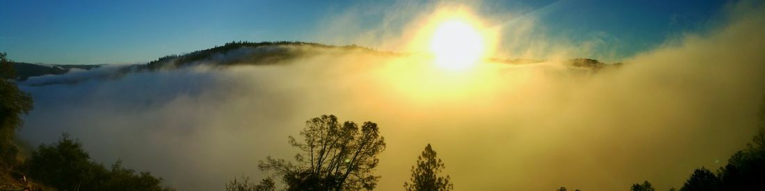 Scenic view of sunset over mountains