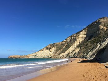 View of beach against blue sky