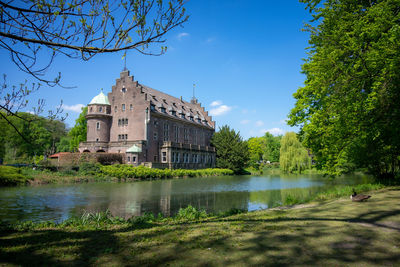 River passing through building against sky