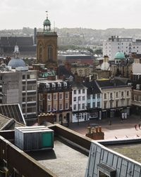 High angle view of buildings in city against sky