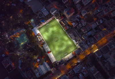 High angle view of illuminated buildings in city at night