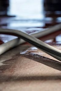 Close-up of rusty metal on table