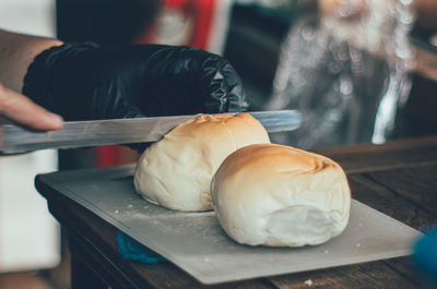 Cropped hand of person preparing food