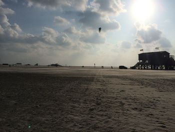 View of calm sea against cloudy sky