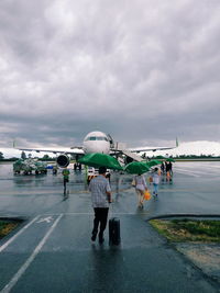 Passengers who want to ride an airplane when the weather is raining.