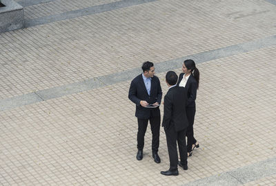 High angle view of business people standing on street