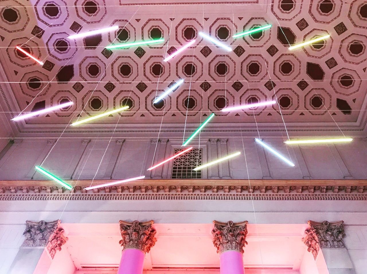 LOW ANGLE VIEW OF ILLUMINATED LIGHTING EQUIPMENT ON GLASS