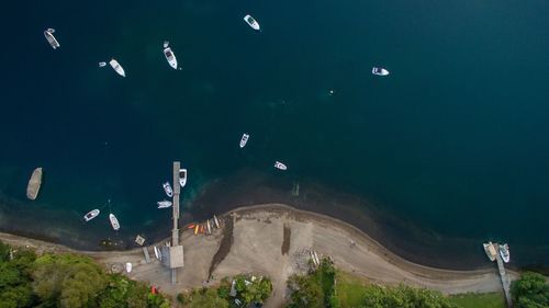 High angle view of boats in calm blue sea