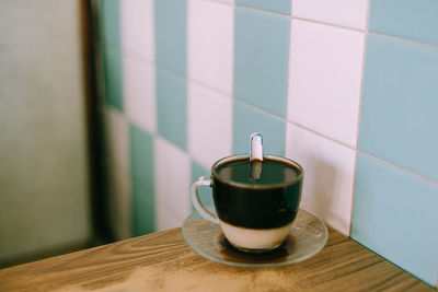 Close-up of coffee cup on table