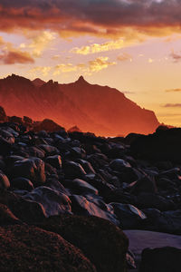 Scenic view of rocks against sky during sunset